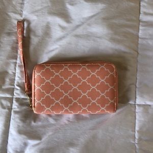 Cute little peachy colored wristlet